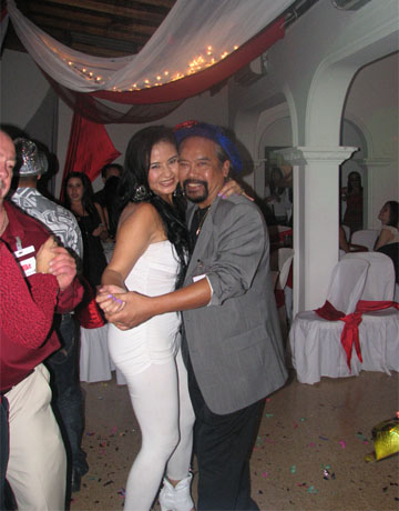 A photo of a client and one of the beautiful Latin singles dancing and enjoying